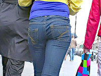 It's a shame that one of these hotties is wearing a coat. Well, at least we can check out her friend's firm butt in jeans hot pants